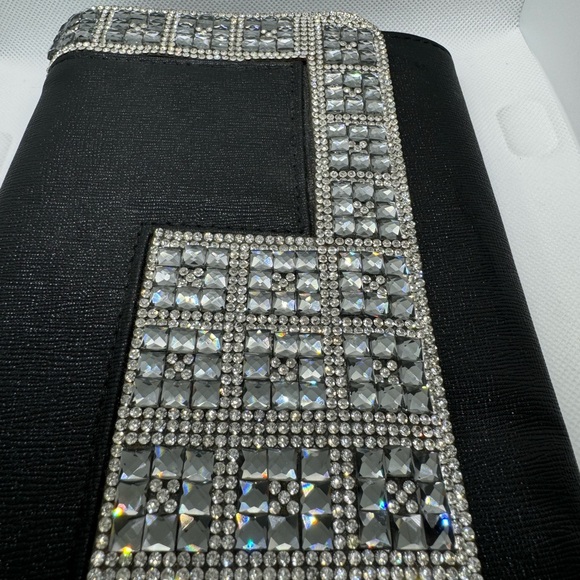 Jeweled black clutch with metal shoulder strap. - Picture 2 of 8